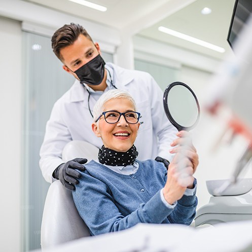 An older woman who’s just received a dental implant