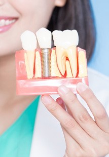 UV light applied to woman’s tooth-colored filling
