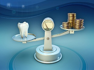 Tooth and coins on a balance scale