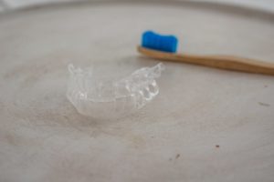 Invisalign in Leesburg with toothbrush resting in background