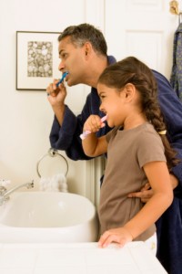 father and daughter practice great at-home oral hygiene thanks to the family dentist Leesburg loves