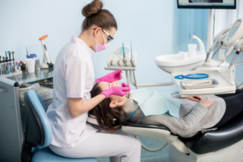 person at dentist about to have tooth extracted