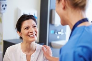 Patient visiting her dentist for a gum grafting consultation.  