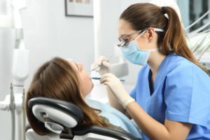 dental hygienist and patient