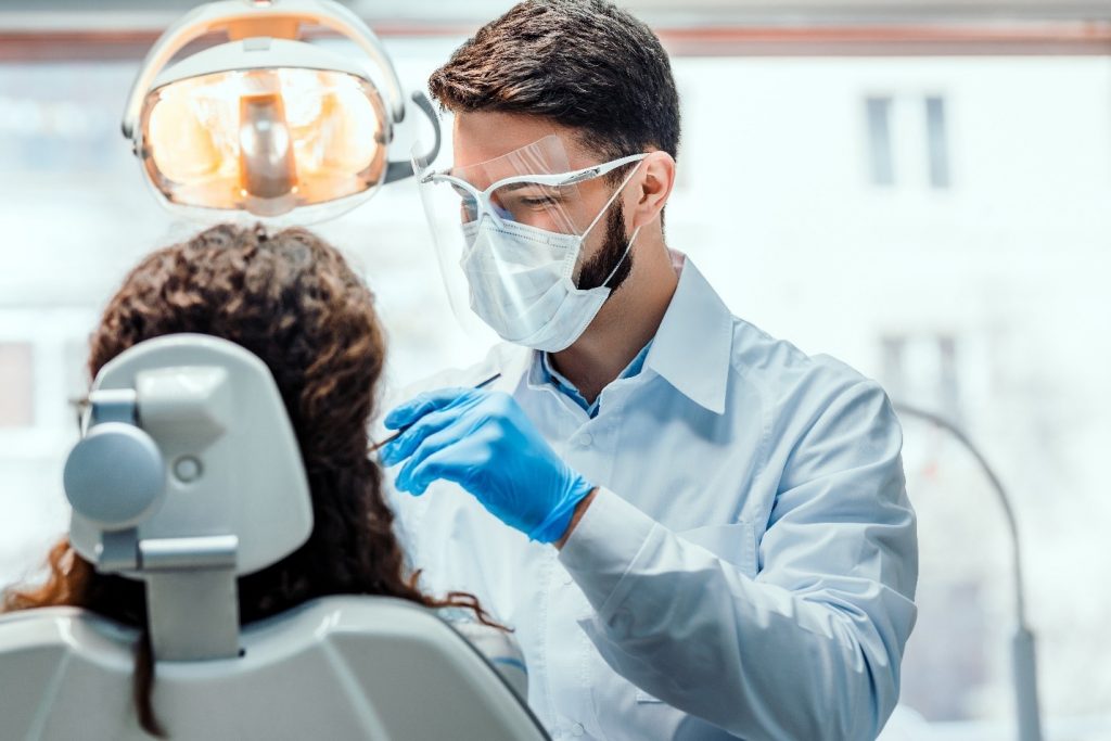 patient with gum disease getting a tooth extraction