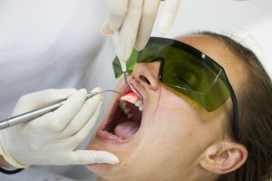 Dentist treating receding gums in Leesburg