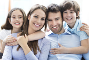 smiling parents and kids see the dentist in Leesburg