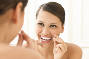 woman about to floss